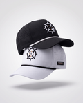 Two PINSEEKER Performance Golf Caps from the Wingman Bundle, Blackout over Whiteout