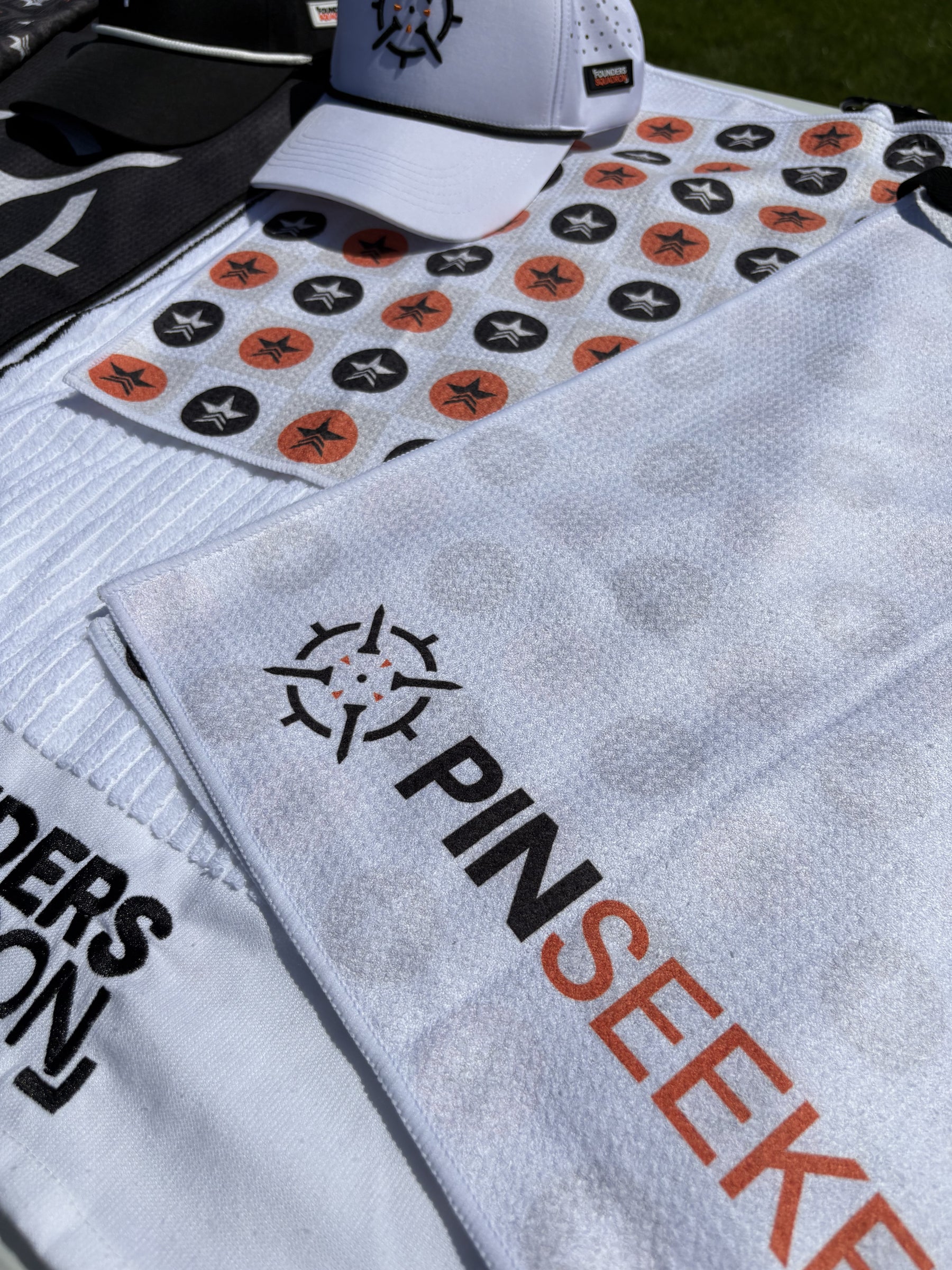 PINSEEKER golf towel and cap range